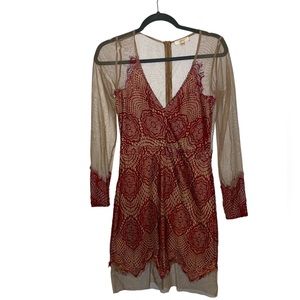 Luxxel Lace and Sheer Mini Dress. Long Sheer Sleeves with lace cuffs. Medium